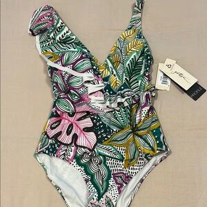 BRAND NEW Beautiful never worn slenderizing one piece ladies swimsuit.